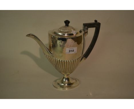 Late Victorian silver coffee pot of oval half fluted pedestal form with ebonised handle, Sheffield, 1899