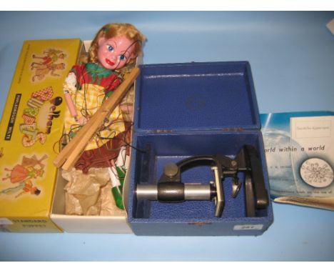 Pelham puppet and a student microscope