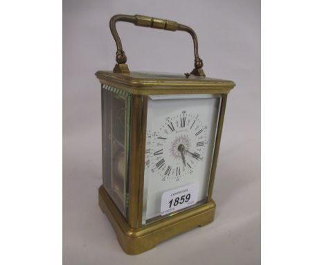 20th Century brass cased carriage clock having enamel dial with Roman numerals and two train movement striking on a gong with