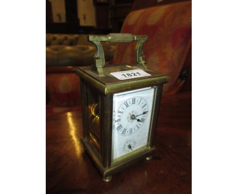 Late 19th or early 20th Century brass cased carriage clock, the enamel dial with Roman numerals and subsidiary alarm dial, th