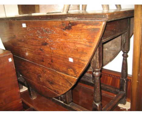 18th Century oak oval gate leg dining table on turned supports
