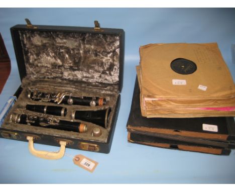 Cased clarinet by Rene Duval together with a quantity of various '78 speed records