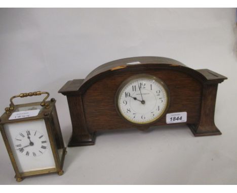 Art Nouveau oak cased mantel clock with circular enamel dial having Arabic numerals, inscribed Mappin & Webb, together with a