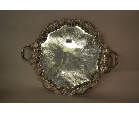 Victorian silver circular two handled tray, the moulded rim with acanthus form handles enclosing a floral engraved centre pan