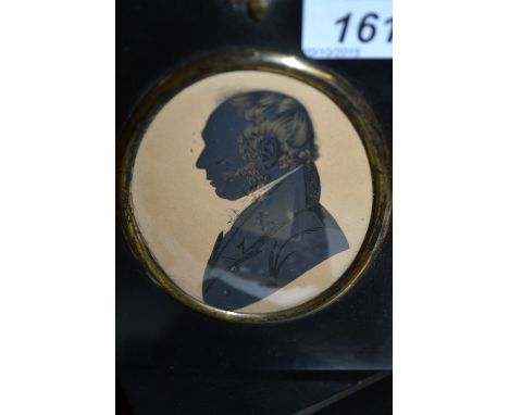 Group of five 19th Century ebonised framed oval mounted portrait silhouette miniatures with gilt highlights