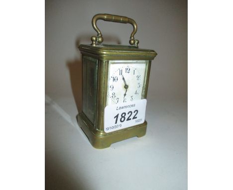 Miniature brass cased carriage clock, the enamel dial with Arabic numerals and single train movement