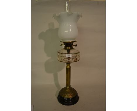 Brass column oil lamp with white opaque glass shade and chimney