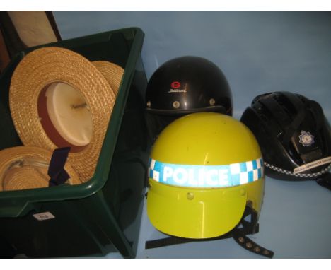 Police motorcycle helmet together with a stadium motorcycle helmet and four straw boater hats