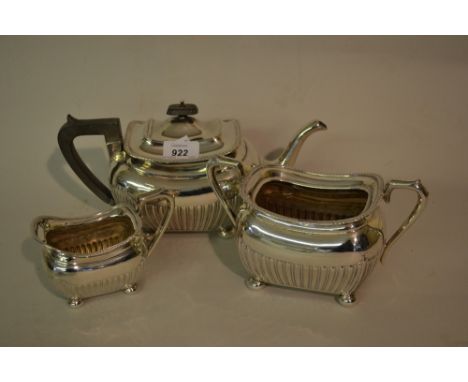 Edwardian silver three piece tea service of rectangular baluster half fluted design with bun feet, Sheffield 1902