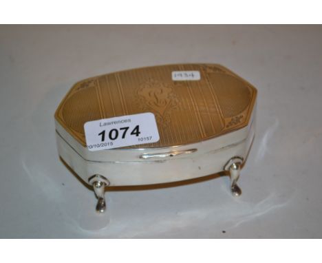 Silver trinket box with engraved and engine turned cover, on an irregular hexagonal body with four shaped feet, Birmingham 19