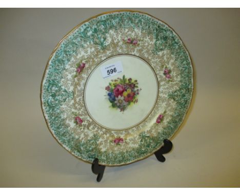 Royal Worcester wall plate painted with flowers with green and gilded borders