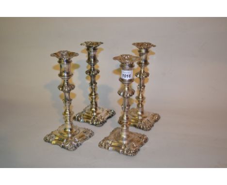 Set of four George IV silver candlesticks, the knopped baluster stems above square shaped bases, Sheffield 1826