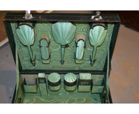 Birmingham silver and green enamel travel dressing set comprising  fifteen pieces in original green leather case