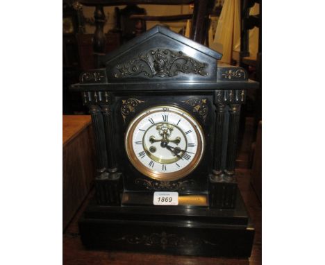 19th Century French black slate metal mounted arch top mantel clock, the enamel dial with Roman numerals and visible escapeme