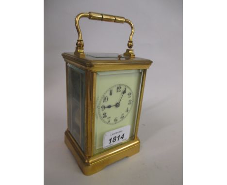 Late 19th or early 20th Century French gilt brass cased carriage clock, the enamel dial with Arabic numerals and two train mo