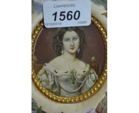 Oval miniature portrait of a young lady within a floral painted border