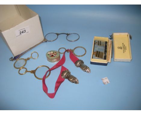 Two quizzing glasses, a pair of white metal and enamel decorated lorgnettes, a book mark in the form of a pair of hands, two 