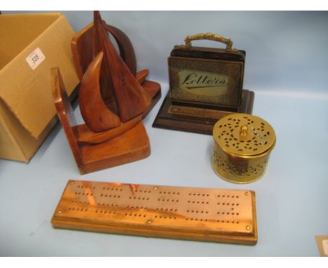 Wooden brass mounted letter rack, pair of wooden boat shaped bookends, a cribbage board and a brass box