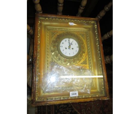 19th Century French gilded composition wall clock, the rectangular glazed case enclosing an enamel dial with Arabic numerals,