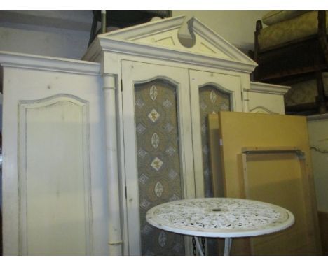 Modern painted and distressed pine larder cupboard in the of a four door French armoire, the architectural pediment above a p