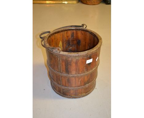 Wrought iron four light candelabra together with an iron bound wooden bucket with swing handle