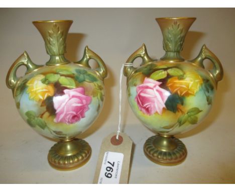 Pair of Royal Worcester two handled baluster form hand painted floral decorated vases, signed F.J. Bray