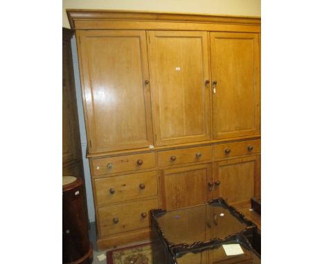 Large 19th Century pine maid's cupboard having rounded moulded cornice above three panel doors, three short drawers and an ar