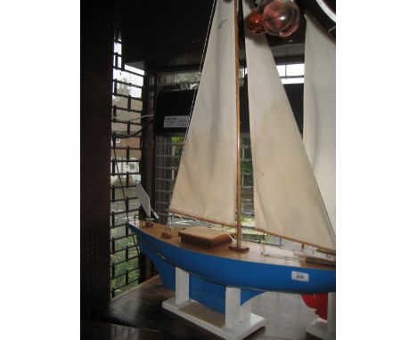 Mid 20th Century sloop rigged model pond yacht with wind vane steering and blue hull with a bulb keel