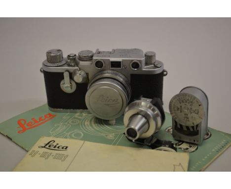 Mid 1950's Leica IIIf camera complete with 1.2 lens, telephoto lens, viewfinder, folding flash, light meter and hood and orig