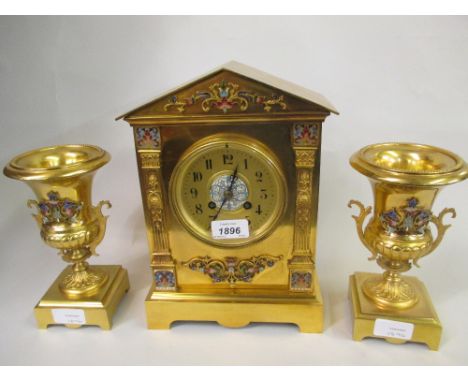 Late 19th or early 20th Century French gilt brass and champleve enamel three piece clock garniture, the architectural case wi