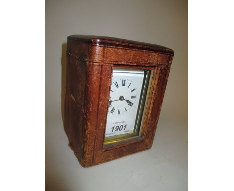 Small early 20th Century brass cased carriage clock with enamel dial and single train movement with original travel case