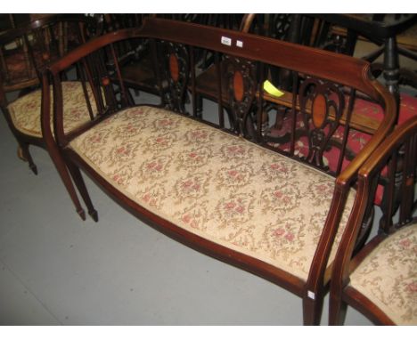 Edwardian mahogany and inlaid three piece drawing room suite comprising: sofa and pair of tub shaped chairs, all with inlaid 