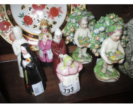 Royal Worcester Cookie candle snuffer with puce mark and four various other candle snuffers