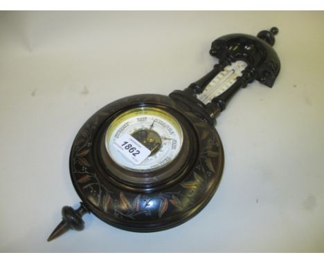 Late 19th Century Aesthetic Movement ebony and fruitwood inlaid aneroid barometer / thermometer