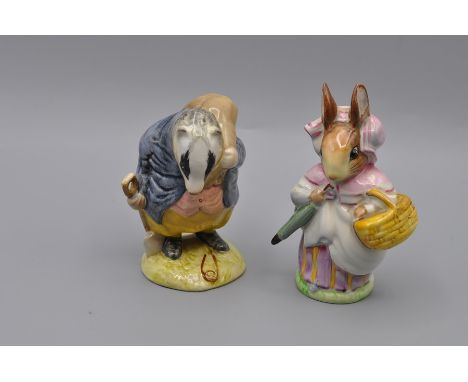 Beswick Beatrix Potter Figurines 'Mrs Rabbit' (BP2a - gold oval first version with umbrella out) and 'Tommy Brock' (BP2a - go