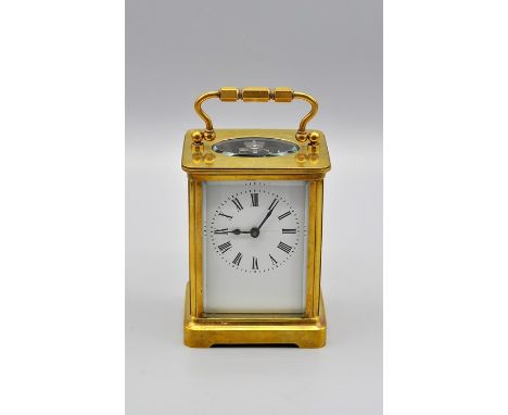 A  French five-glass carriage clock, white enamel dial inscribed Roman numerals, swing carrying-handle, rounded rectangular t