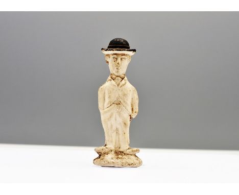 A vintage pipe clay cake decoration topper of Charlie Chaplin  