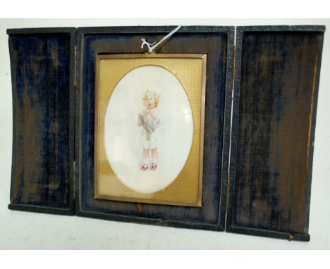 A late Victorian leather cased and brass framed portrait miniature depicting a young girl with teddy bear and wearing red sho