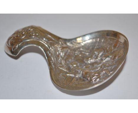 A circa 1900 Dutch silver and embossed caddy spoon with import marks