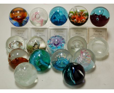 A collection of principally Caithness Glass paperweights