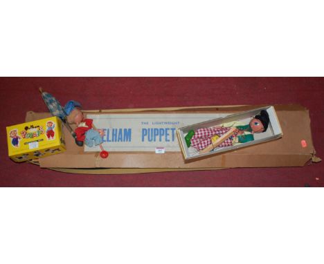 The Lightweight Pelham Puppet Theatre; together with two cased and one loose Pelham Puppets 