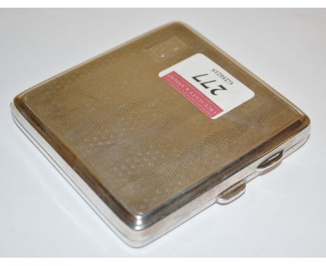 An engine turned silver pocket cigarette case