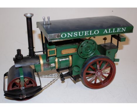 A reproduction tinplate scale model of a steam roller 