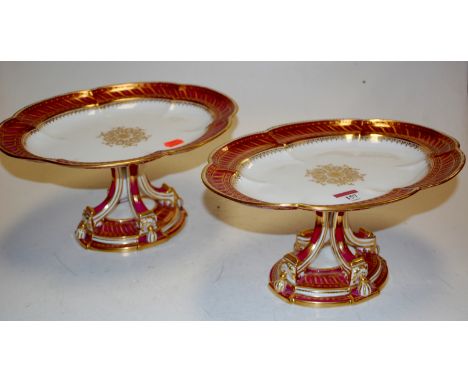 Pair of late 19th century porcelain high comports, each with gilt enamel decoration 
