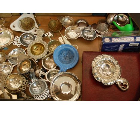 Three boxes of tea strainers to include; silver plate, ceramic and WMF examples 