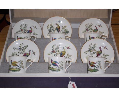 A Royal Worcester cased porcelain six place setting of coffee cans and saucers