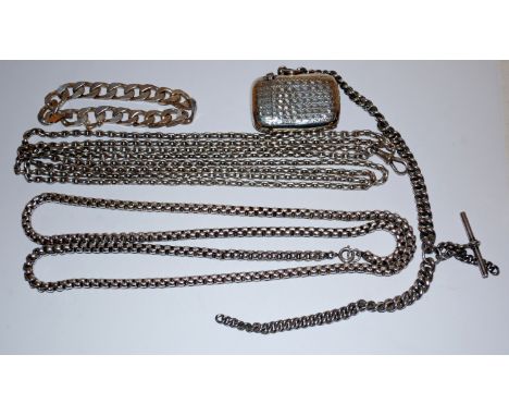 An engine turned silver vesta case on silver curb link watch chain, and a quantity of silver and white metal chains