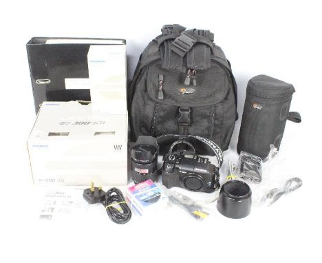 Photography - A boxed Olympus E300 kit with additional lens, camera bag, filters and similar.