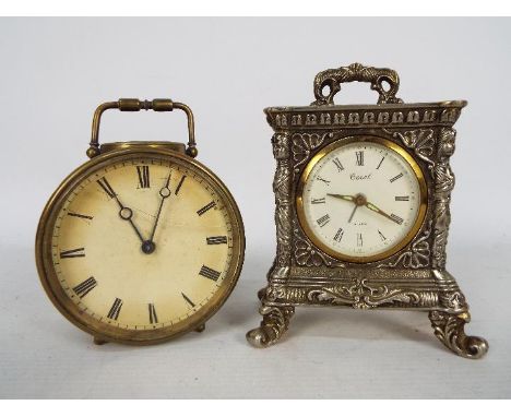 Two vintage desk clocks. [2]Condition Report: Clocks are not currently running, glass cracked to the circular cased example.