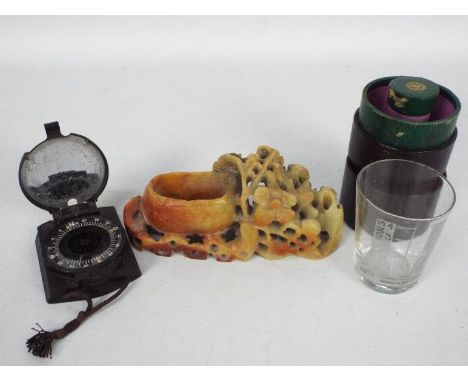 A German military marching compass and a Chinese soapstone brush washer.